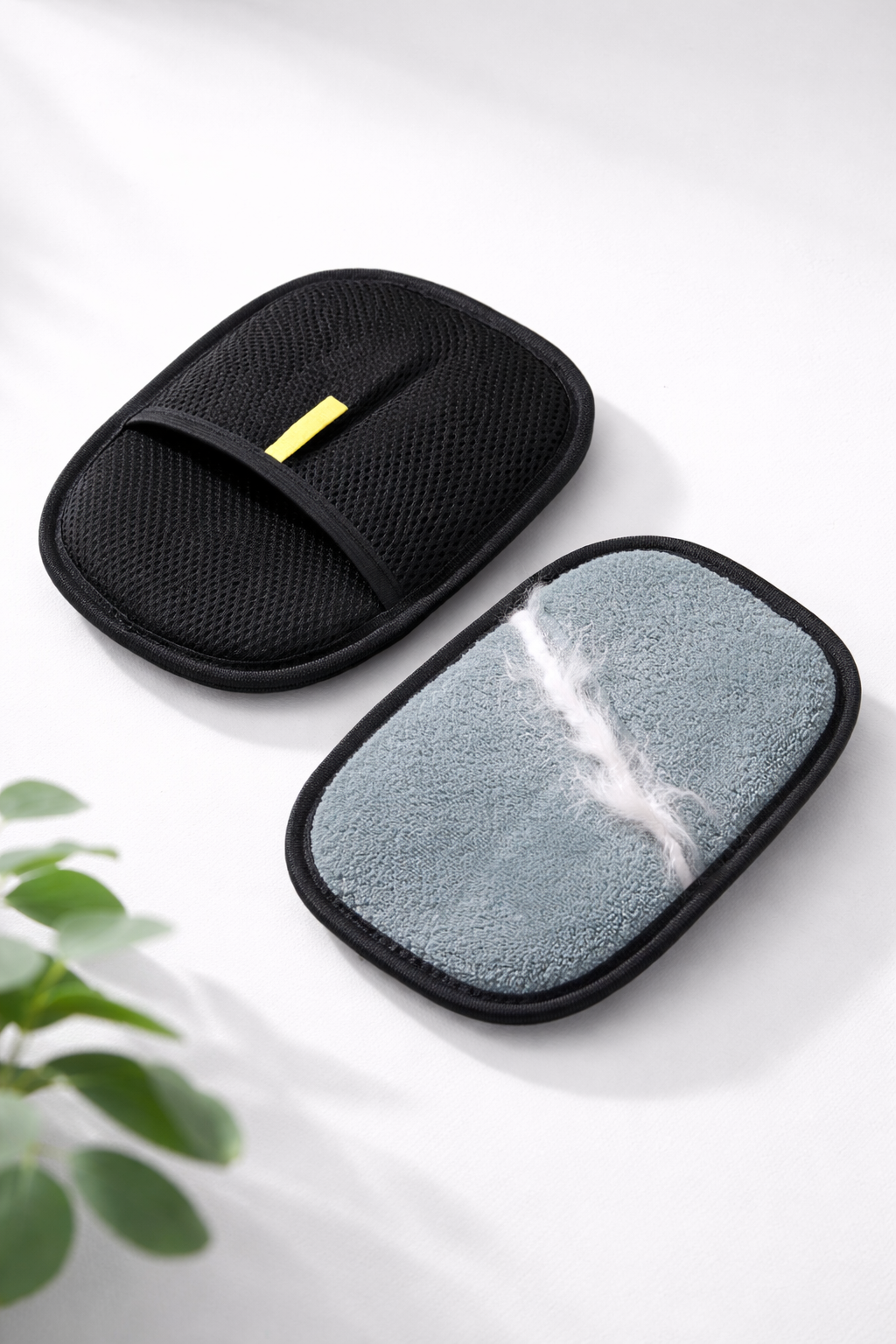 PawGroom furniture hair remover glove — front and back studio shot