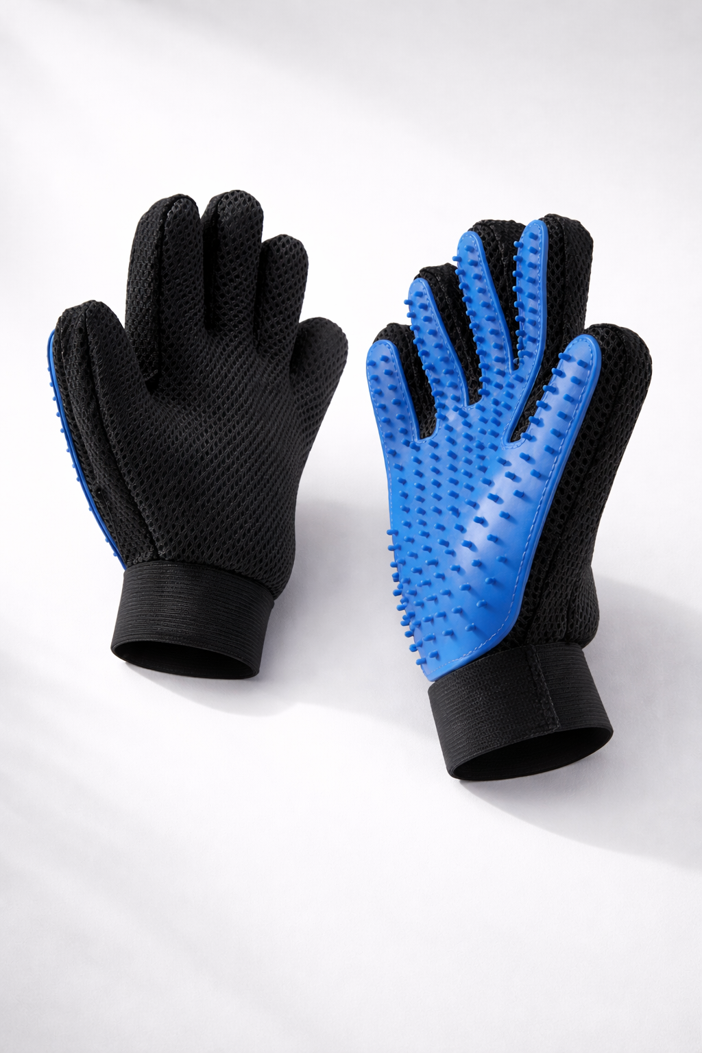PawGroom silicone grooming glove studio shot — blue and black pair
