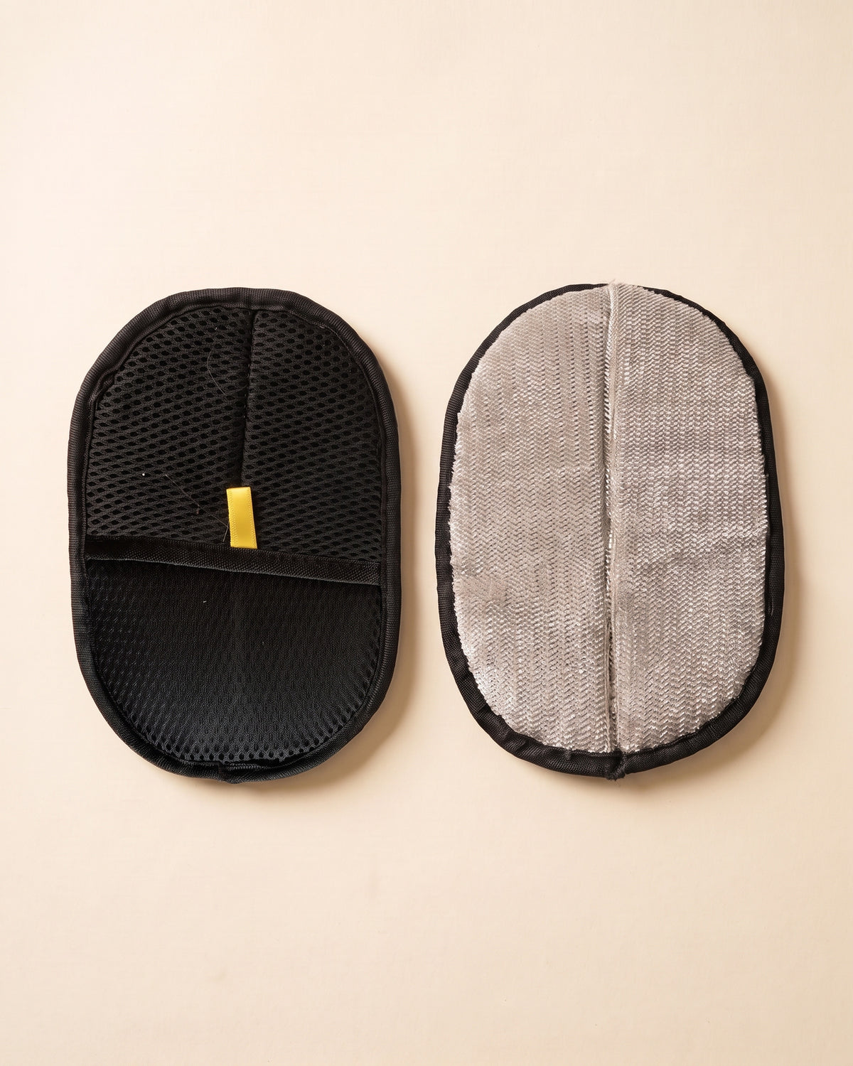 PawGroom furniture mitt — black mesh side and ribbed side